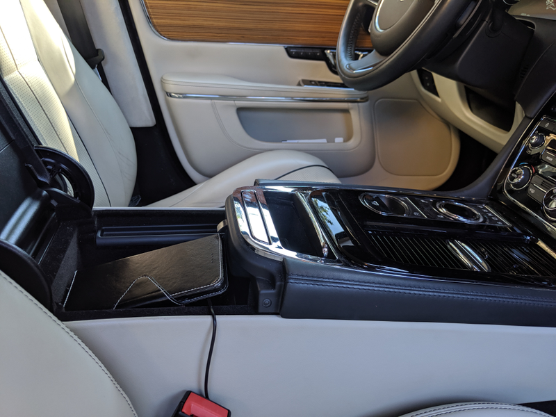 The centre console bin is on the small side. There’s some room below, but my phone won’t fit. Dash cam cord runs out and under the carpets, because the only 12V outlet is inside this bin.
